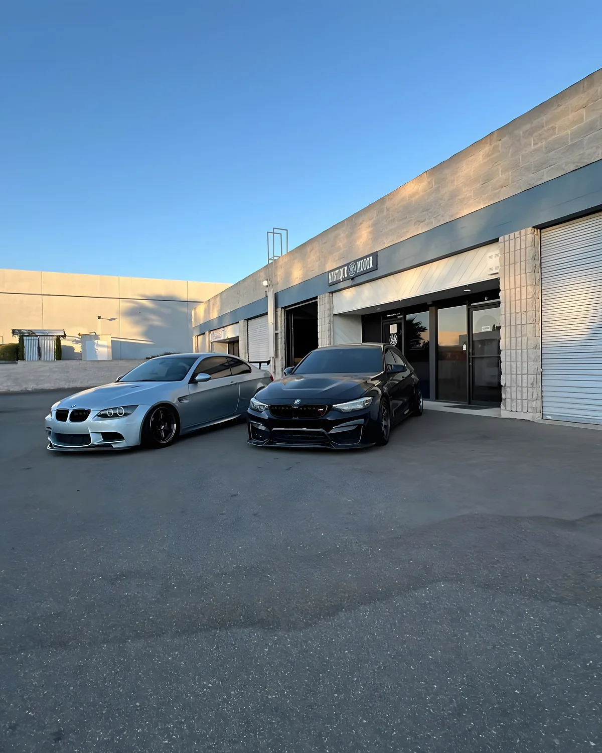Two BMW M cars in front of the Mystique Motors shop in Simi Valley